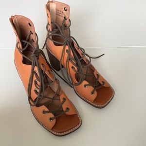 Orange leather lace-up heels from Free People